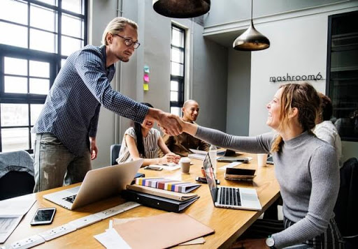 Office Employees Shaking Hands